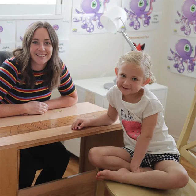Tutor working with young girl
